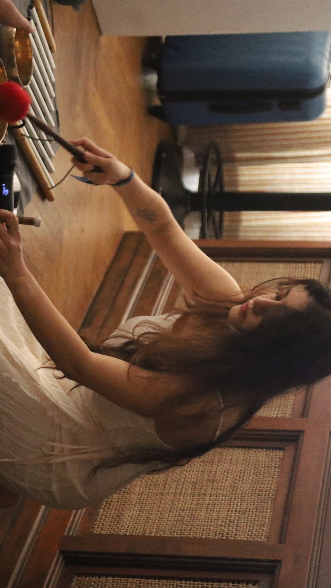 The sound healer at her brass singing bowls during the Forevermark by De Beers morning, Soho House Mumbai
