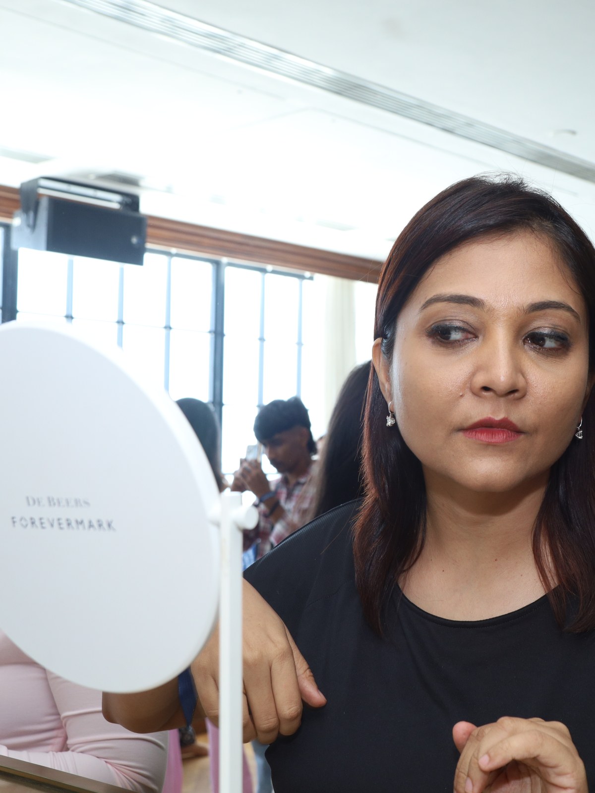 A guest at the De Beers Forevermark mirror during the morning at Soho House Mumbai